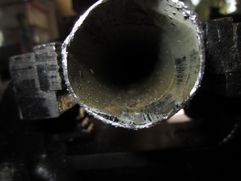 This Fiero coolant tube has been reshaping by hammering a socket into it.